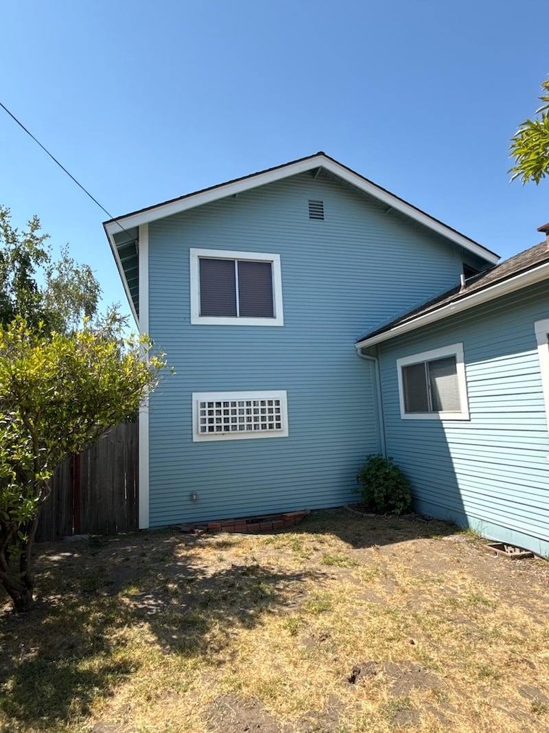 After: Exterior painted grey-blue